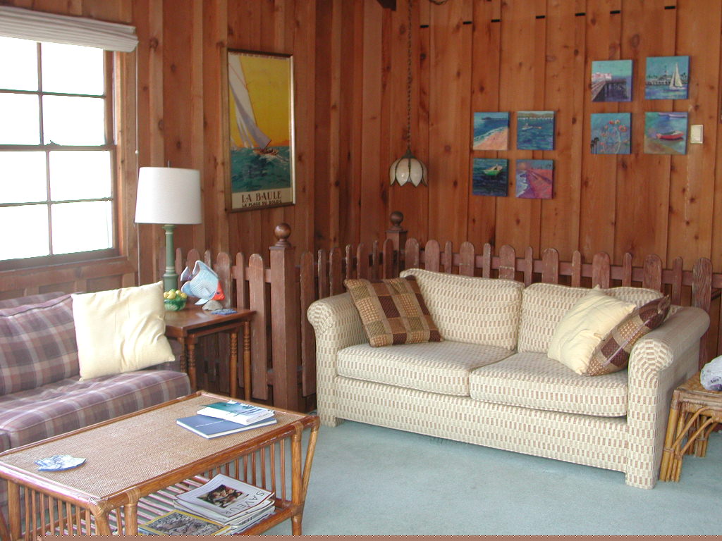 This warm friendly beach house is decorated in family antiques and beach memorabilia and art.